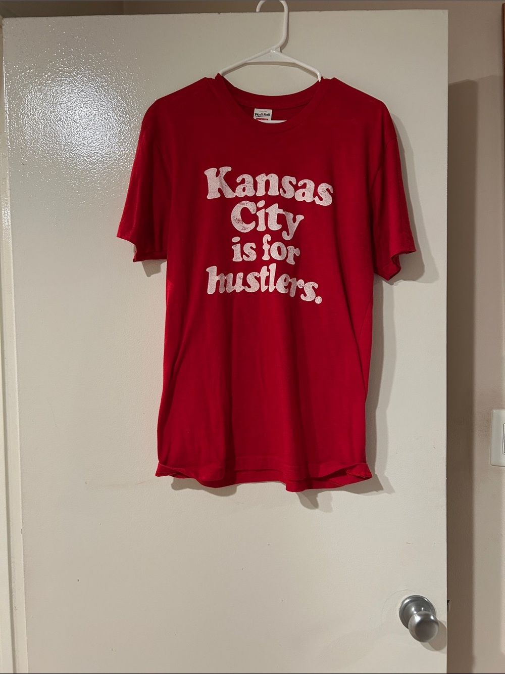 Red Graphic Tee with White 'Kansas City is for hustlers.' Slogan